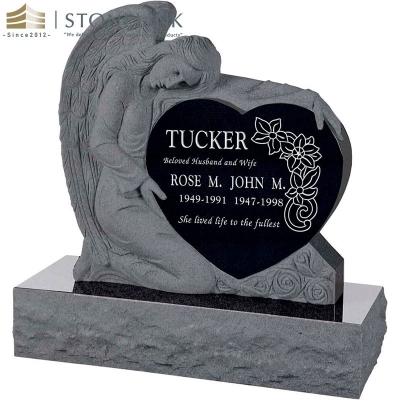 Single angel holding heart granite headstone