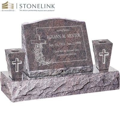 Granite slant headstone with vases