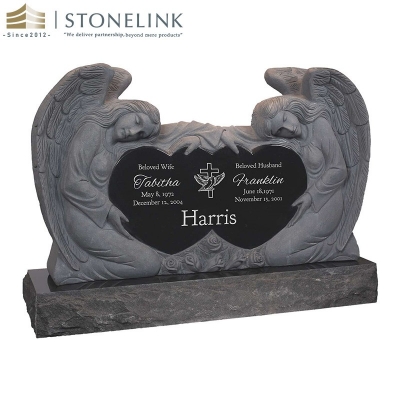 Kneeling angels embracing double heart granite headstone